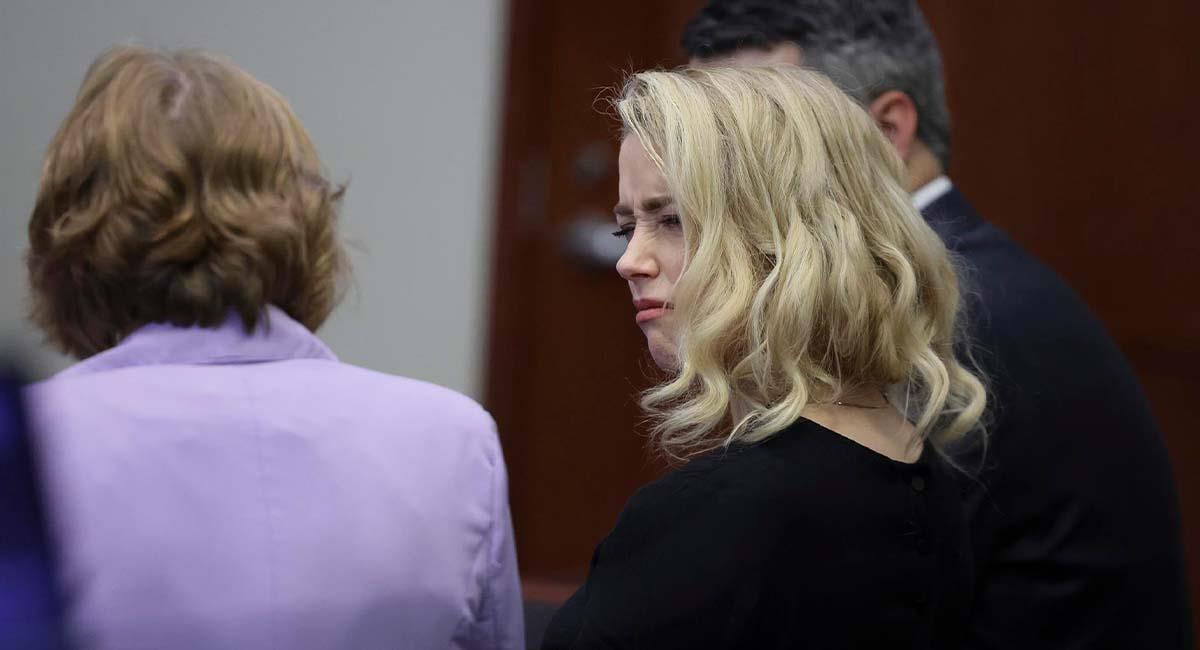 Amber Heard reacciona enojada ante la decisión del jurado. Foto: EFE